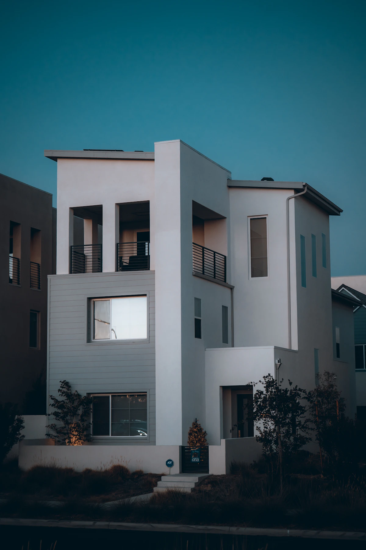 A modern white house at dusk